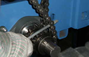 It is likely that a large, standard screwdriver will be necessary to position the final chain over the sprocket.